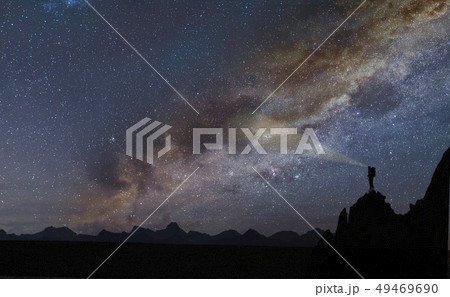 Silhouette of rocks under starscape in the Dolomites, South Tyrol, Italy 49469690