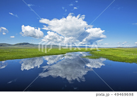 Clouds over river through fields in Fairfield, Idaho, USA 49469698
