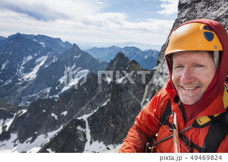 Mature man mountain climbing on Mount Stuart in North Cascade Mountains, Washington, USA Mature man mountain climbing on Mount Stuart in North Cascade Mountains, Washington, USA 49469824