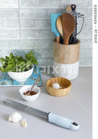 Grater with garlic on kitchen counter Grater with garlic on kitchen counter 49469869