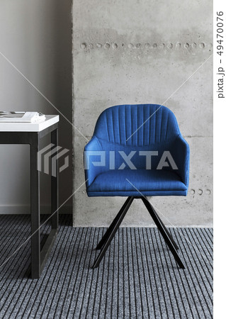 Blue chair by desk 49470076