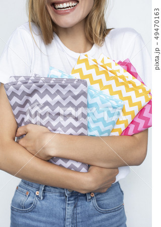 Woman holding colorful zigzag fabrics 49470163