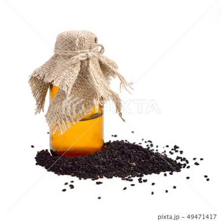 Nigella oil with seeds. Nigella oil with seeds. 49471417