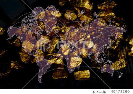 Double exposure of pile of gold nuggets with city 49472190