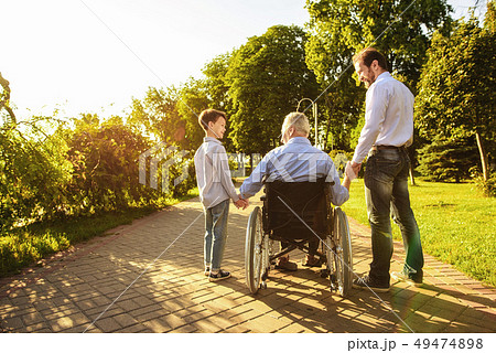 Family Together. Grandson and Son Visit Old Man. 49474898