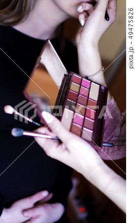 Hand use palette colorful and brush set makeup, beauty and fashion Hand use palette colorful and brush set makeup, beauty and fashion 49475826