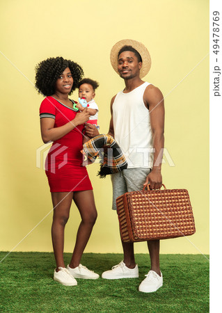 Happy family having picnic at studio 49478769