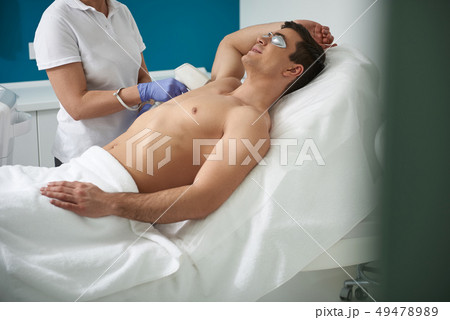 IPL hair removal procedure of man armpit IPL hair removal procedure of man armpit 49478989