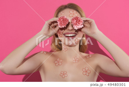 Happy blonde lady closing eyes by carnation 49480301