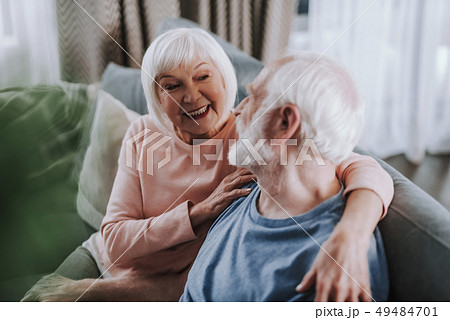 Happy aged couple enjoying being together at home Happy aged couple enjoying being together at home 49484701