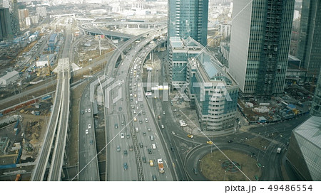 Aerial view of the beginning of a city road traffic jam in a business district 49486554