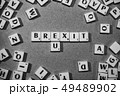brexit spelled in scrabble letters surrounded by other letters 49489902