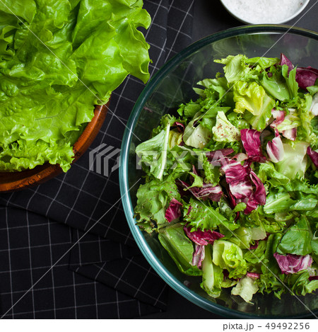 Fresh vegetarian salad mix in a clear glass bowl. Fresh vegetarian salad mix in a clear glass bowl. 49492256