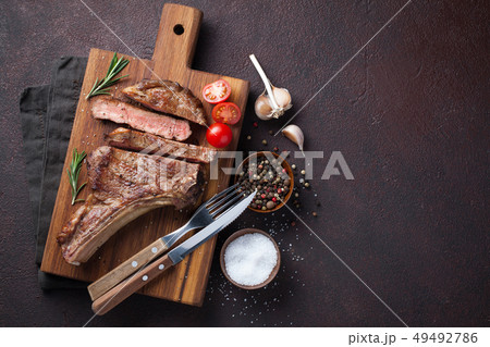 Grilled cowboy beef steak. 49492786