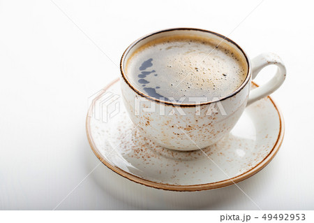 White Cup with cappuccino coffee. White Cup with cappuccino coffee. 49492953