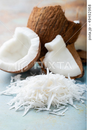 Coconut flakes on a blue background. 49492968