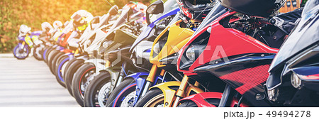 Motorcycles group parking on city street in summer 49494278