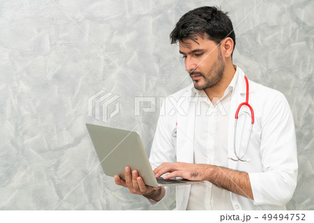 Doctor using laptop computer at the hospital. Doctor using laptop computer at the hospital. 49494752