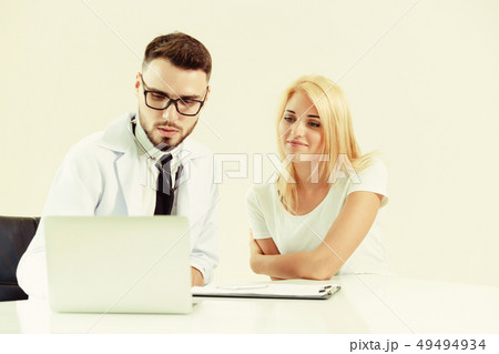Male Doctor and Female Patient in Hospital Office Male Doctor and Female Patient in Hospital Office 49494934