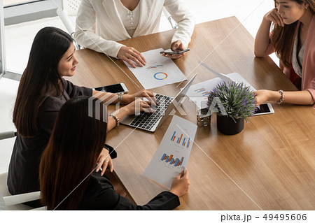 Businesswomen in Meeting, Laptop Computer on Table 49495606