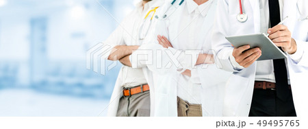 Doctor working in hospital with other doctors. Doctor working in hospital with other doctors. 49495765