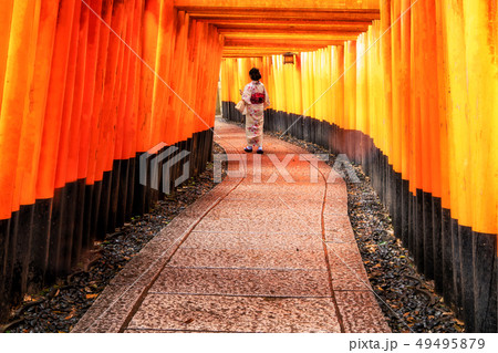 Traveler in Fushimi Inari Shrine, Kyoto, Japan Traveler in Fushimi Inari Shrine, Kyoto, Japan 49495879