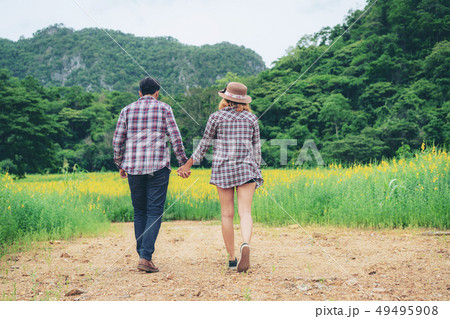 Happy couple take a romantic walk on the hills. Happy couple take a romantic walk on the hills. 49495908