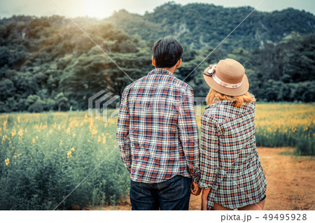Happy couple take a romantic walk on the hills. Happy couple take a romantic walk on the hills. 49495928