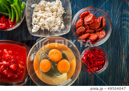 Ingredients for preparing frittata - eggs, sausage 49504047