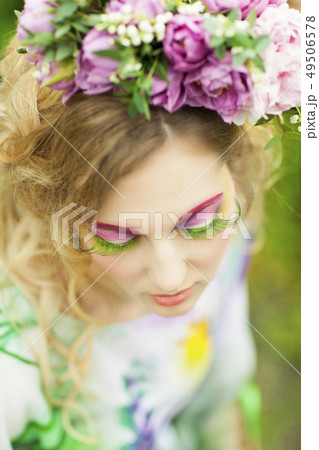 Woman with tulips, lily of the valley and pink 49506578