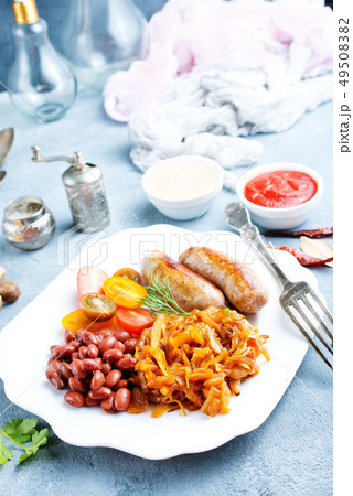 sausages with fried cabbage 49508382