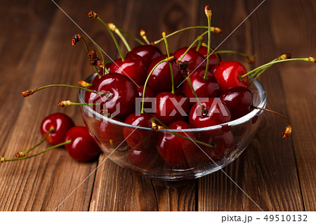 Bowl with fresh red Cherries. 49510132