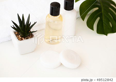 Wellness Products and Cosmetics. Spa still life with blossoms of rose and essential oils Wellness Products and Cosmetics. Spa still life with blossoms of rose and essential oils 49512842