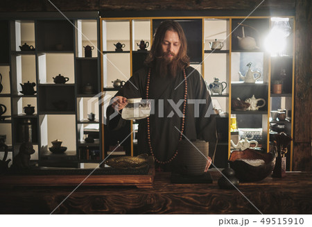 Tea ceremony is perfomed by tea master Tea ceremony is perfomed by tea master 49515910