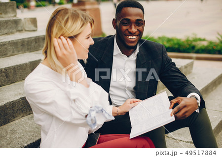 businesswoman with partner in a city 49517884