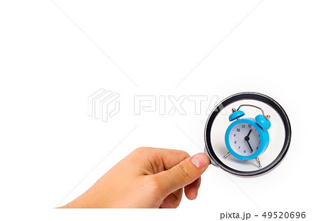 A blue alarm clock on a white background. A blue alarm clock on a white background. 49520696