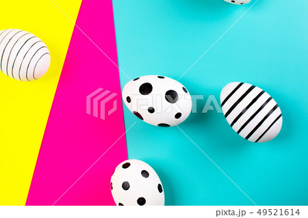 Different graphic hand drawn eggs on bright background in trendy colors. Different graphic hand drawn eggs on bright background in trendy colors. 49521614