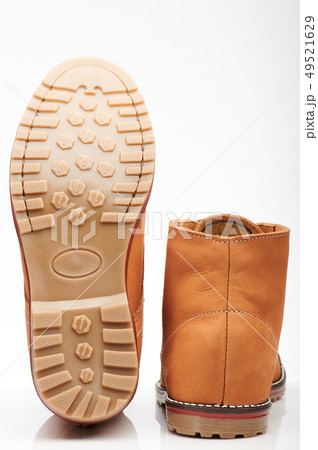 Back and sole of brown tall shoes Back and sole of brown tall shoes 49521629