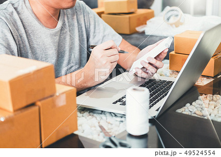 SME freelance man working with packaging startup SME freelance man working with packaging startup 49524554