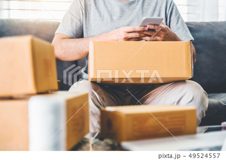 SME freelance man working with packaging startup SME freelance man working with packaging startup 49524557