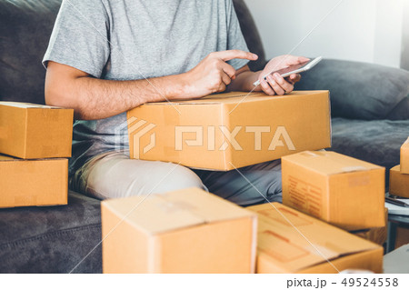 SME freelance man working with packaging startup 49524558