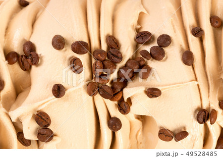 Many coffee beans on the ice-cream close-up. Many coffee beans on the ice-cream close-up. 49528485