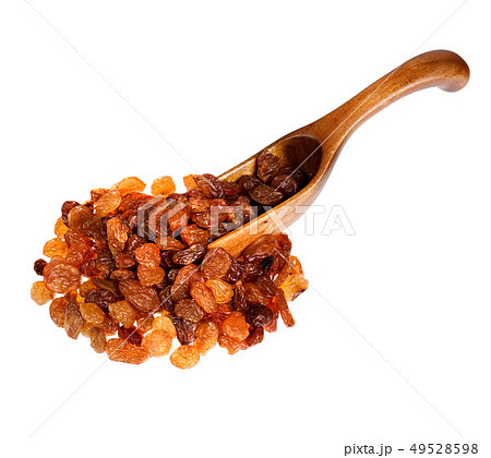 Raisins in the wooden spoon, isolated on white background. 49528598