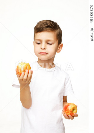 Little boy is holding  apples studio shot  49536876