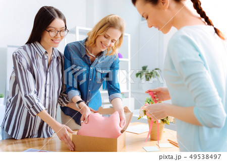 Positive delighted girls working together 49538497