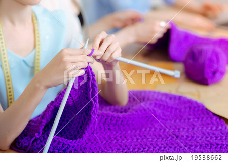 Close up of female hands that doing cardigan Close up of female hands that doing cardigan 49538662