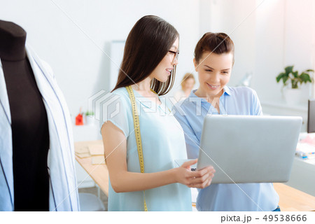 Positive girls discussing new collection Positive girls discussing new collection 49538666