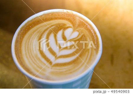 Coffee Barista holding a take away cup with milk 49540903