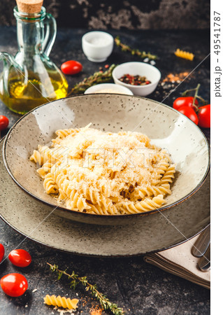 Cooked fusilli pasta in plate 49541787