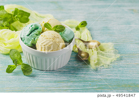 Ice cream with mint in ceramic bowl Ice cream with mint in ceramic bowl 49541847